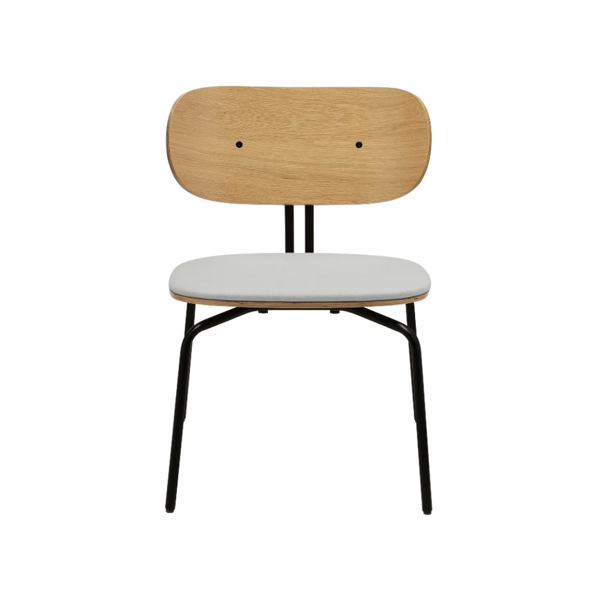 The Conversation Piece fabric armchair with natural frame