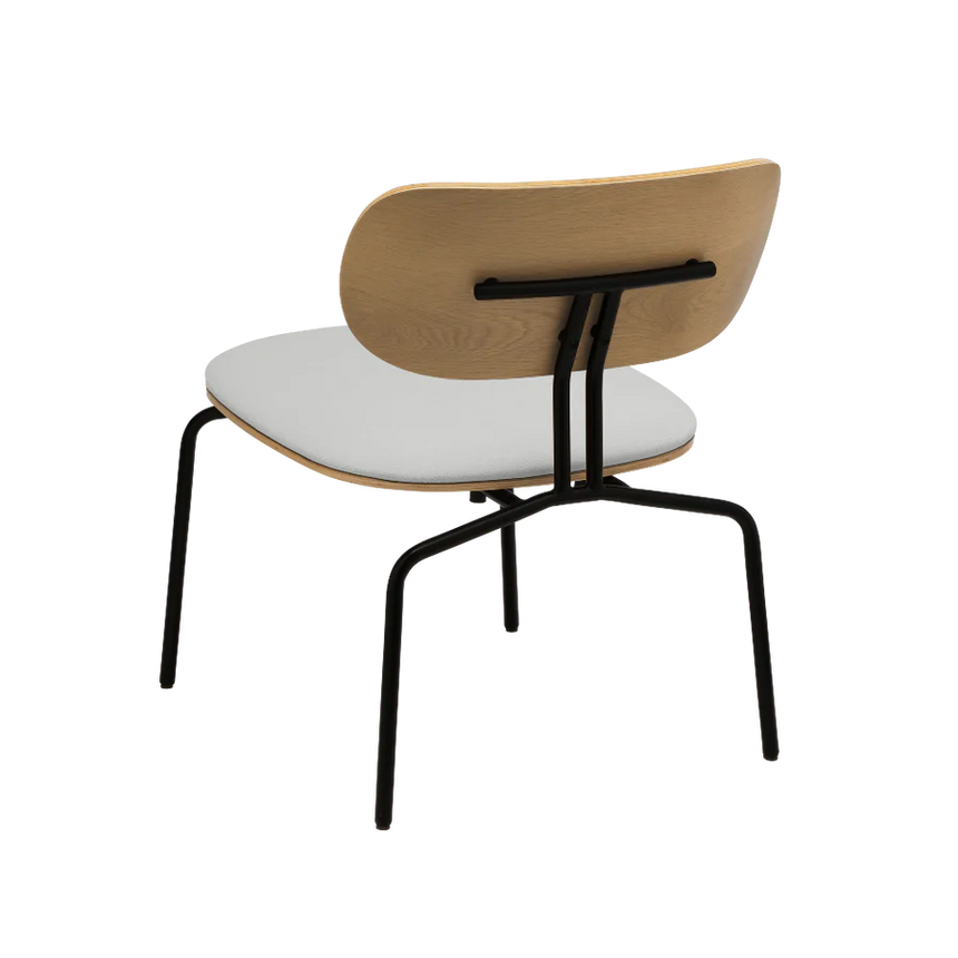 The Conversation Piece fabric armchair with natural frame