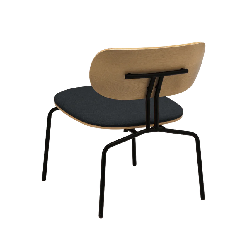 The Conversation Piece fabric armchair with natural frame