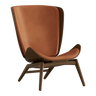 The Conversation Piece leather armchair with natural frame