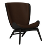 The Conversation Piece leather armchair with natural frame
