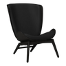 The Conversation Piece leather armchair with natural frame