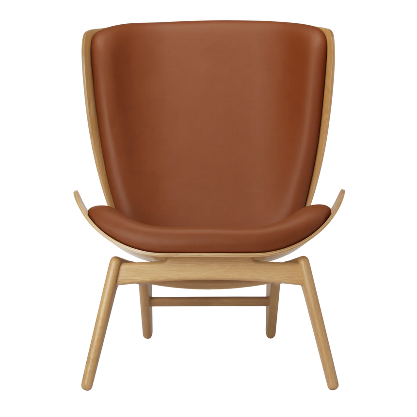 The Conversation Piece leather armchair with natural frame