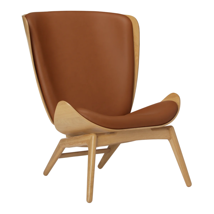 The Conversation Piece leather armchair with natural frame