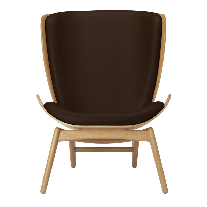 The Conversation Piece leather armchair with natural frame