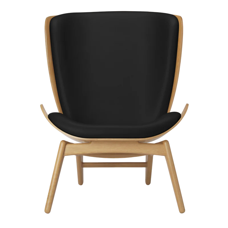 The Conversation Piece leather armchair with natural frame